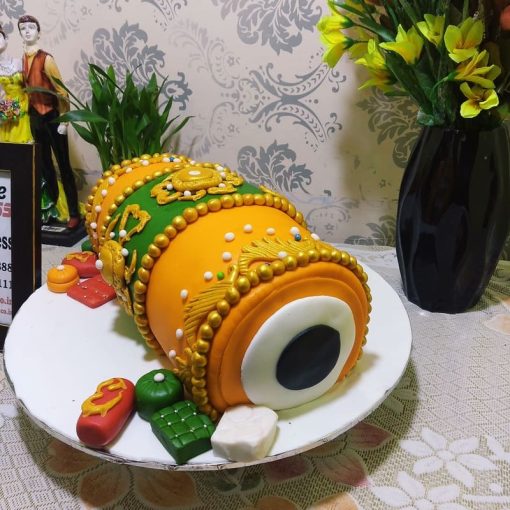 Orange Dhol Shape Fondant Cake